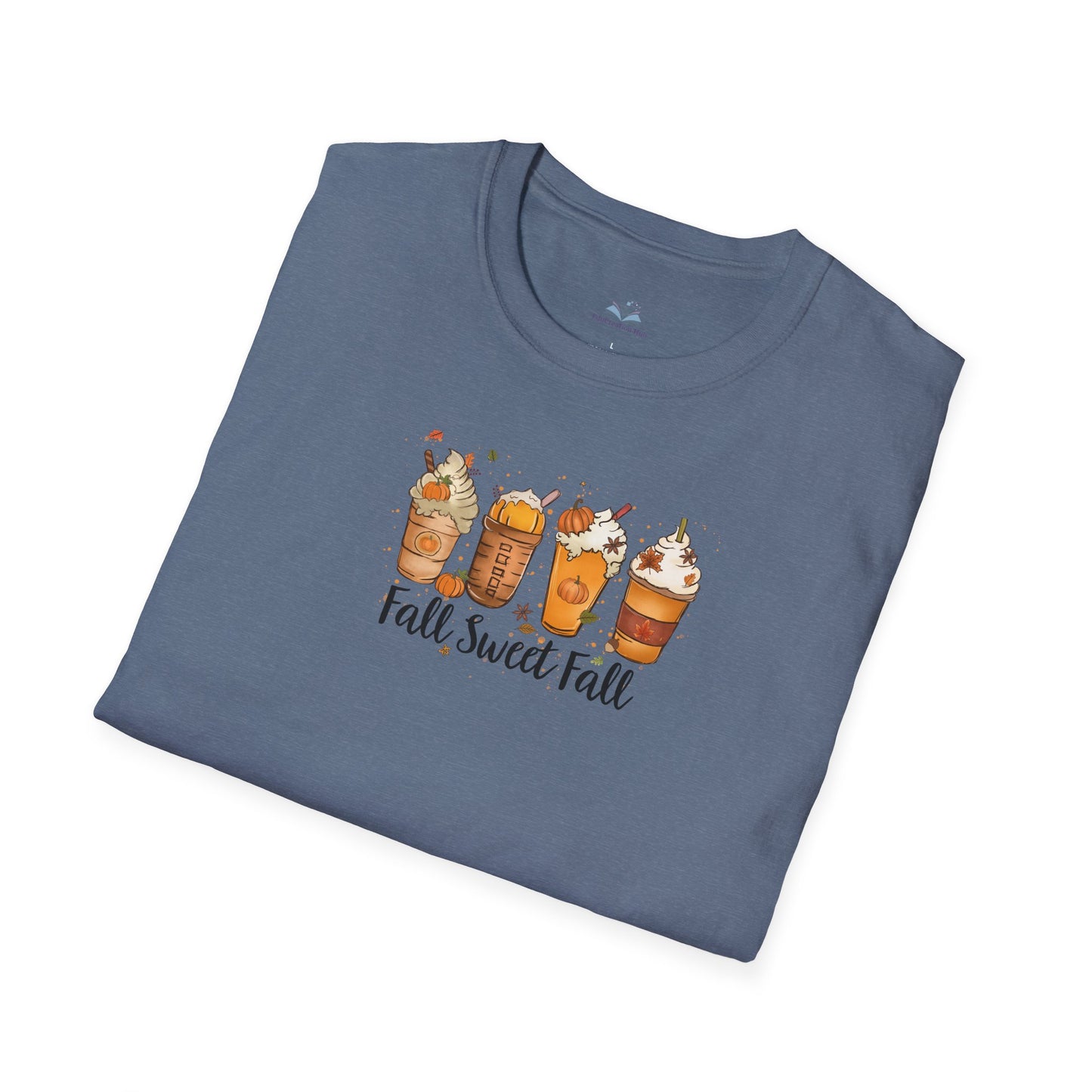 Folded blue t-shirt with fall-themed design on a white background