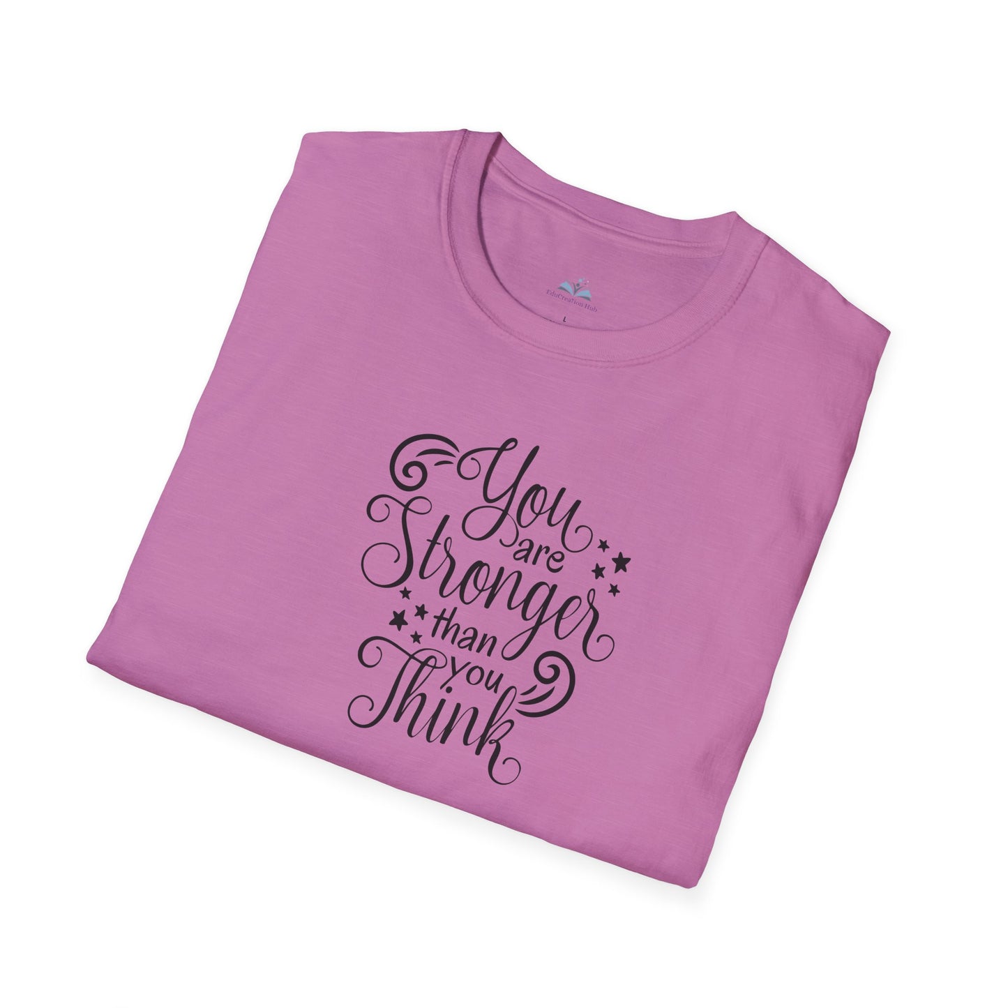 Folded pink t-shirt with motivational quote on a white background