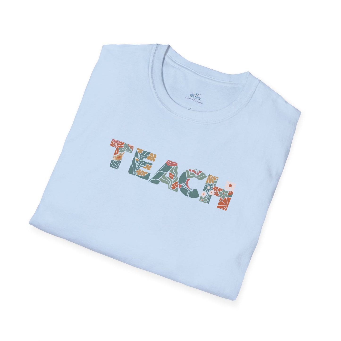 Light blue t-shirt with 'TEACH' printed on it, folded on a white background