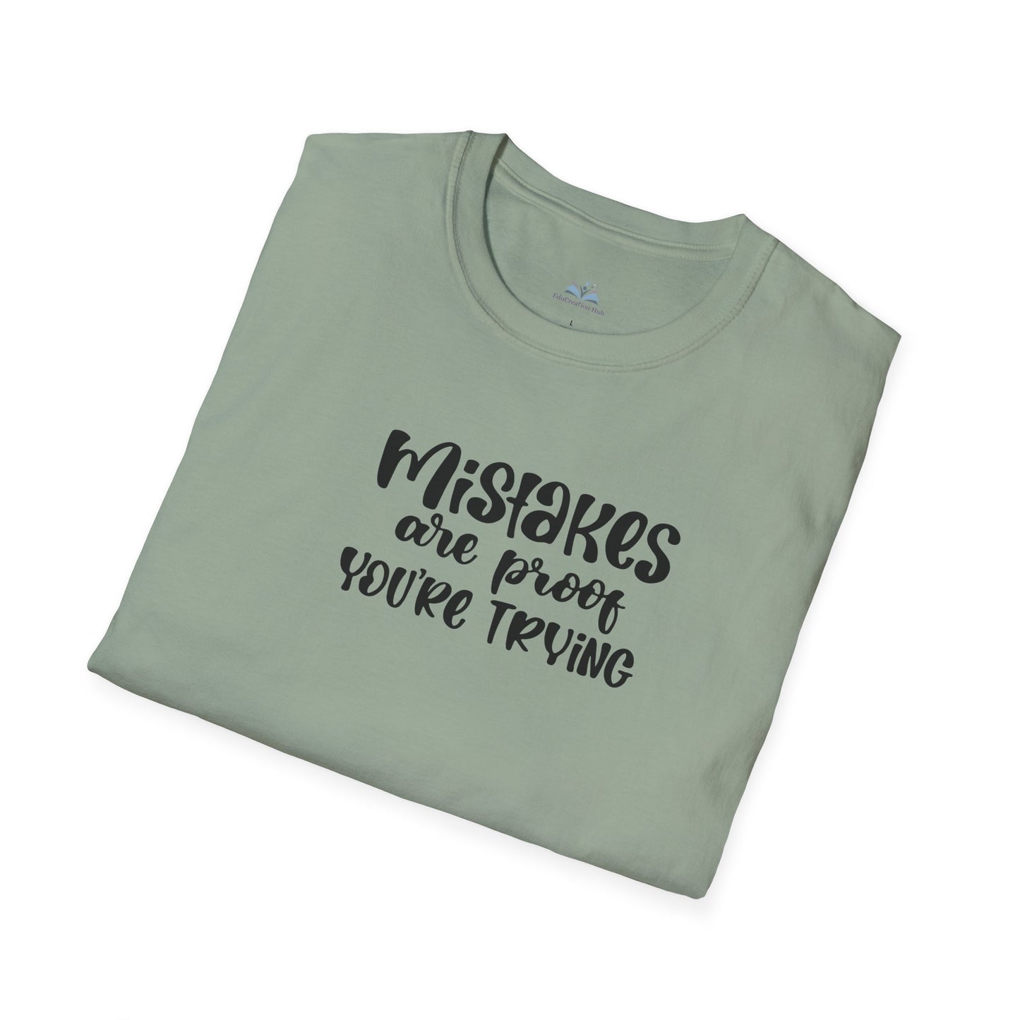 Folded green t-shirt with motivational text on a white background