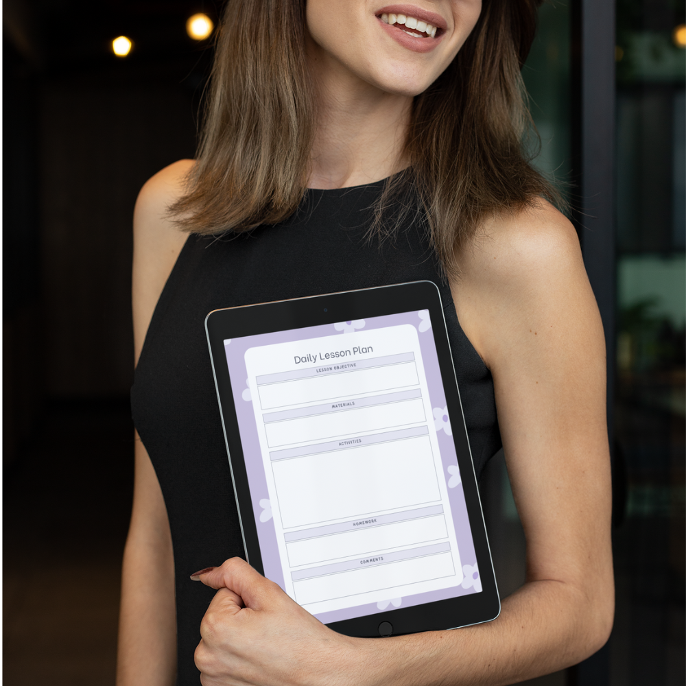 Woman holding a tablet displaying a daily lesson plan.