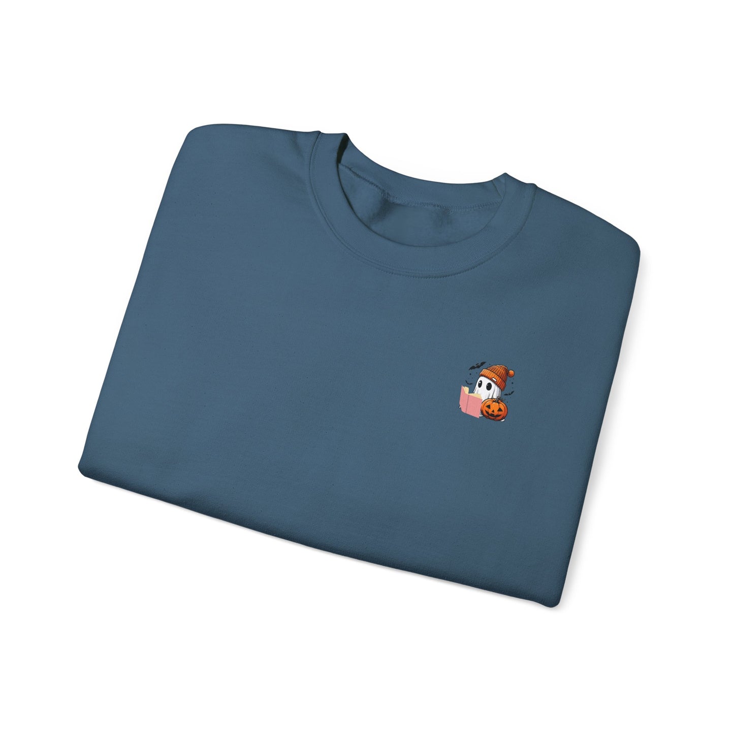 Folded blue t-shirt with a small cartoon character on a white background