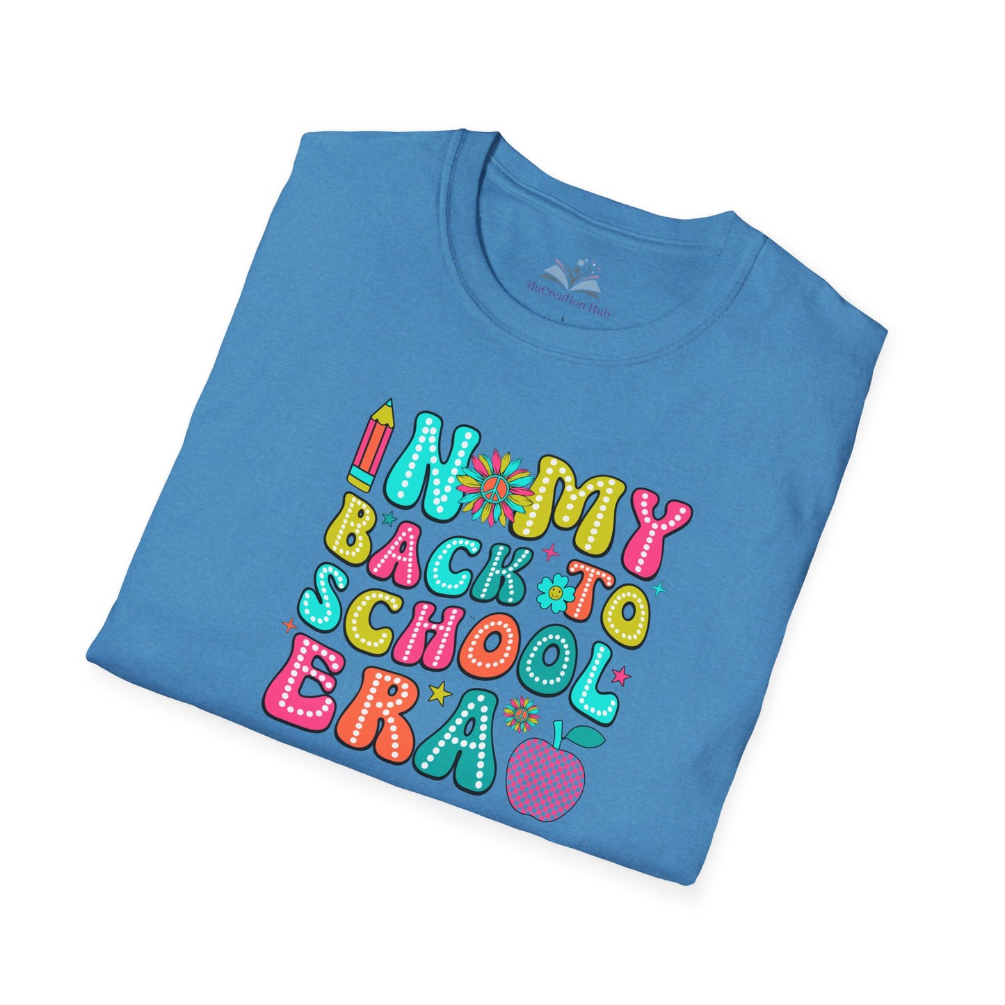 Folded blue t-shirt with colorful 'Back to School' text design on a white background