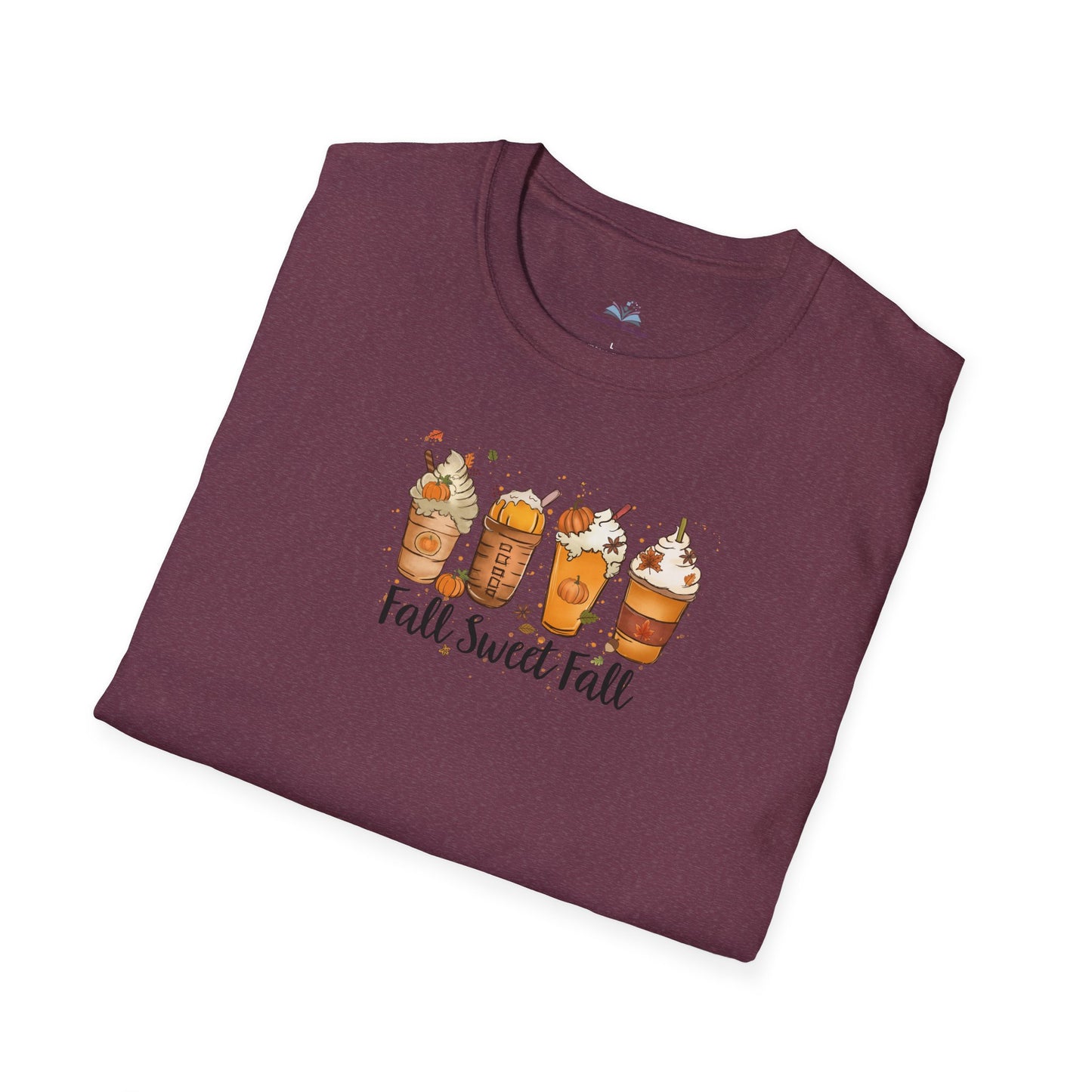 Folded maroon t-shirt with fall-themed design on a white background