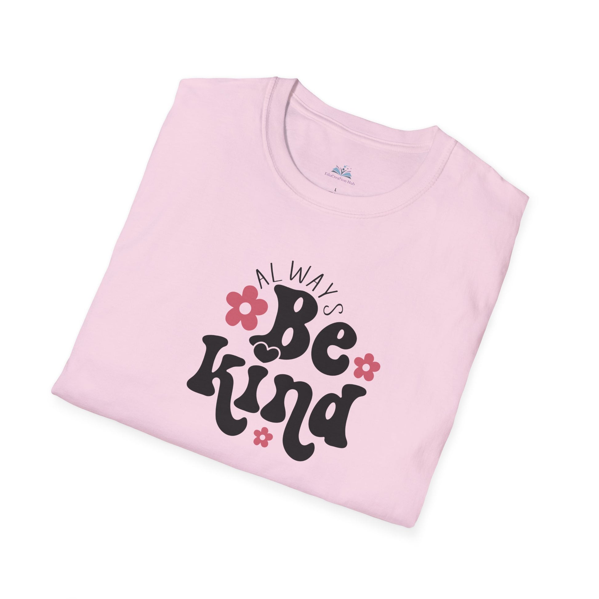 Folded pink t-shirt with 'Always Be Kind' text and flowers on a white background