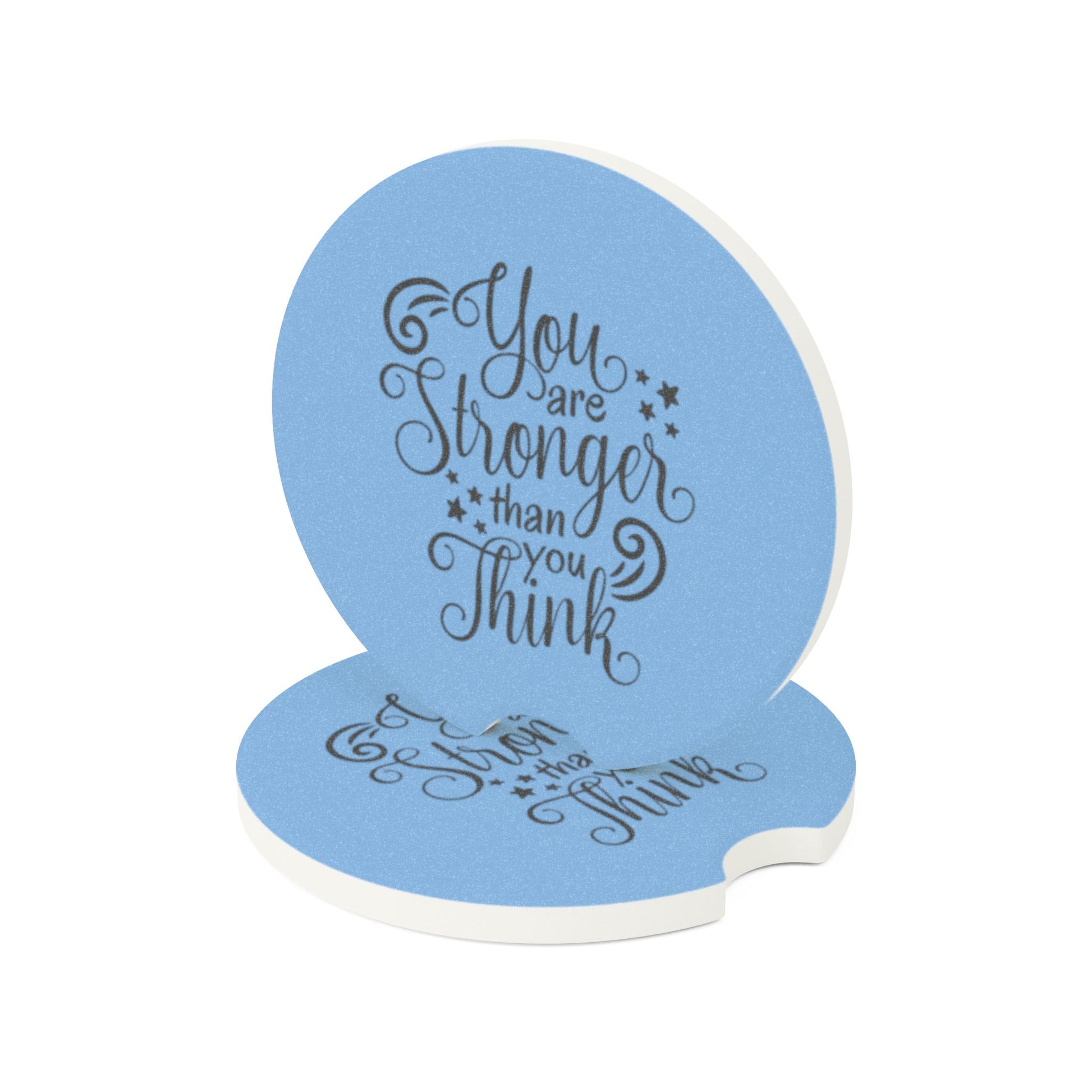 Blue coaster with motivational quote on a white background