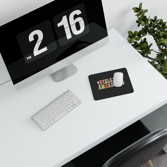 Computer monitor with digital clock display on a desk with keyboard and mouse.