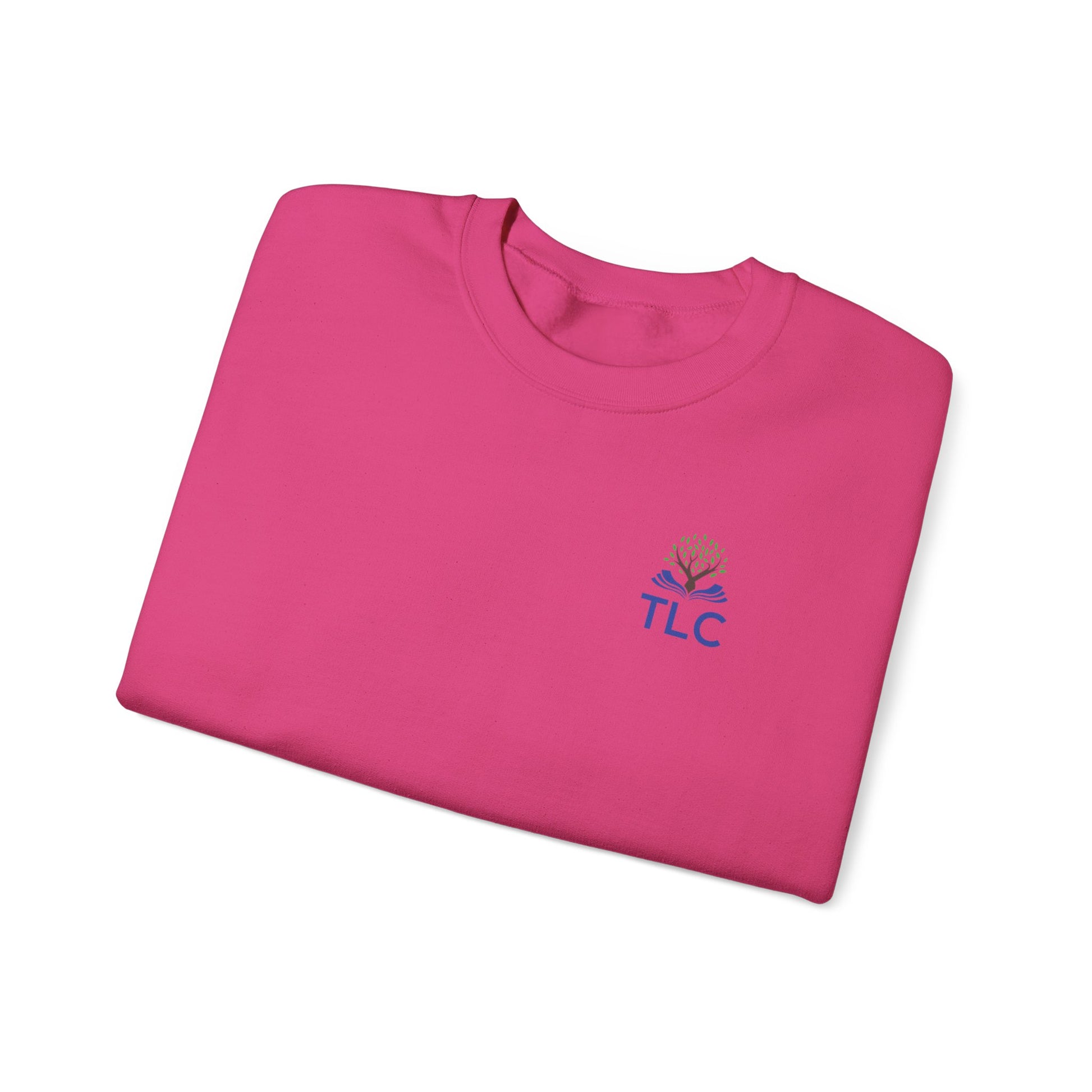 Folded pink shirt with 'TLC' logo on a white background