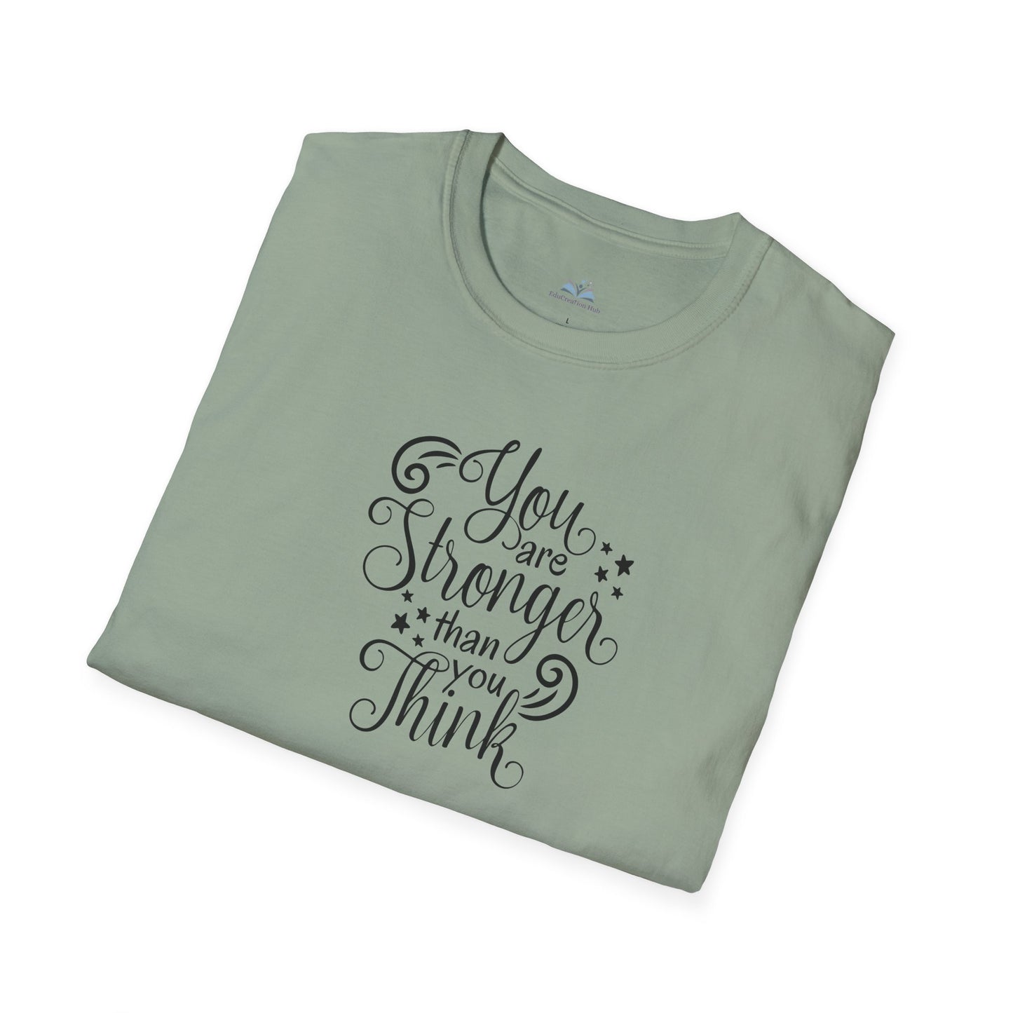 Folded light green t-shirt with motivational quote on a white background
