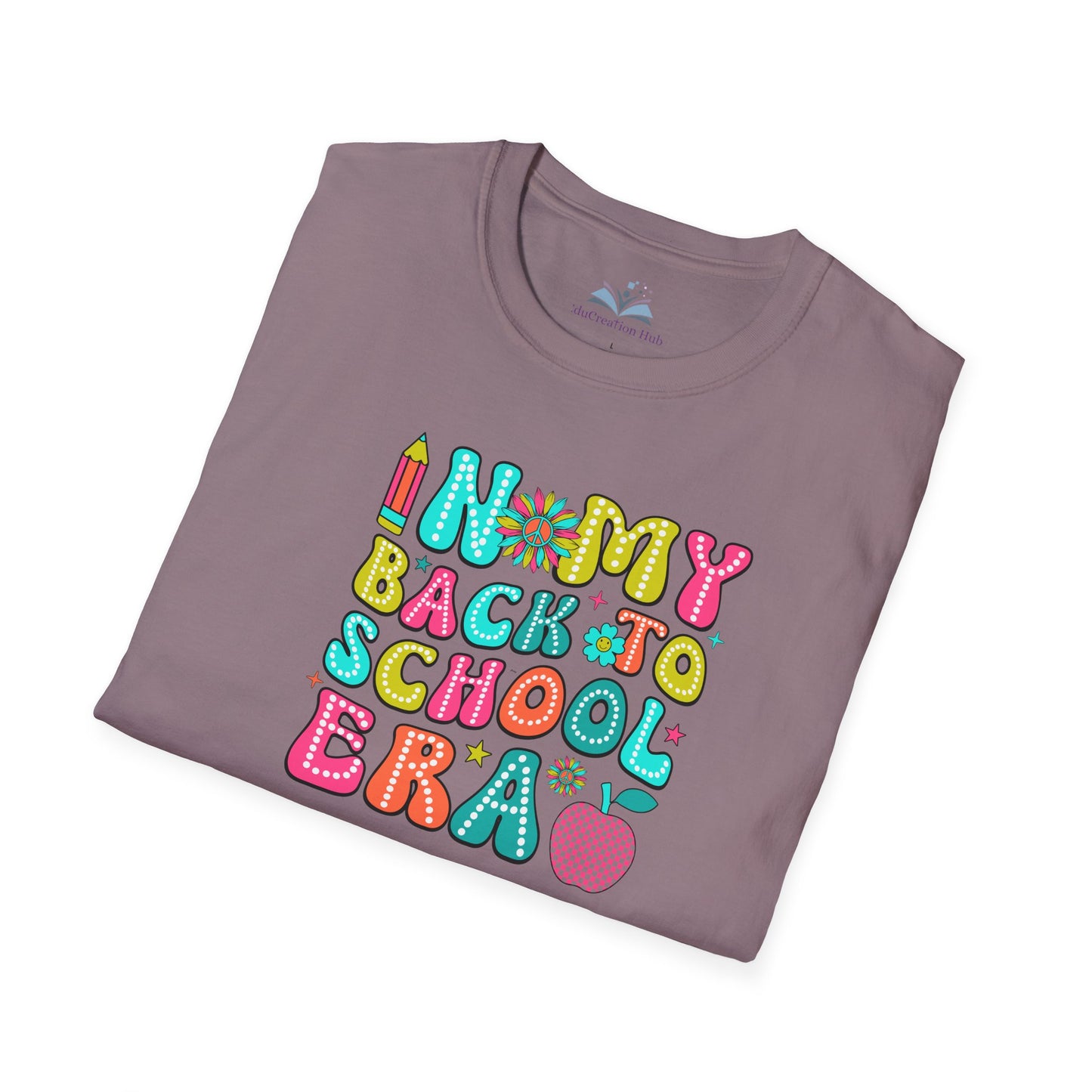 Folded t-shirt with colorful 'Back to School' text design on a white background