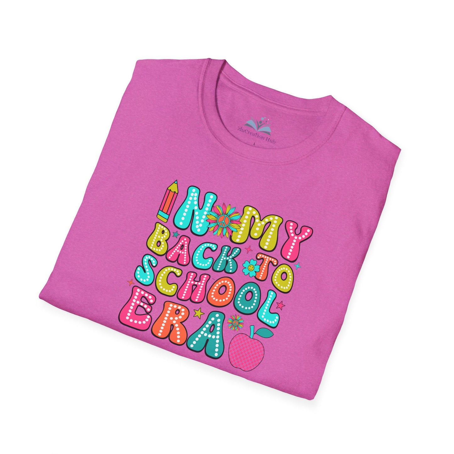 Folded pink t-shirt with colorful 'Back to School Era' text design on a white background