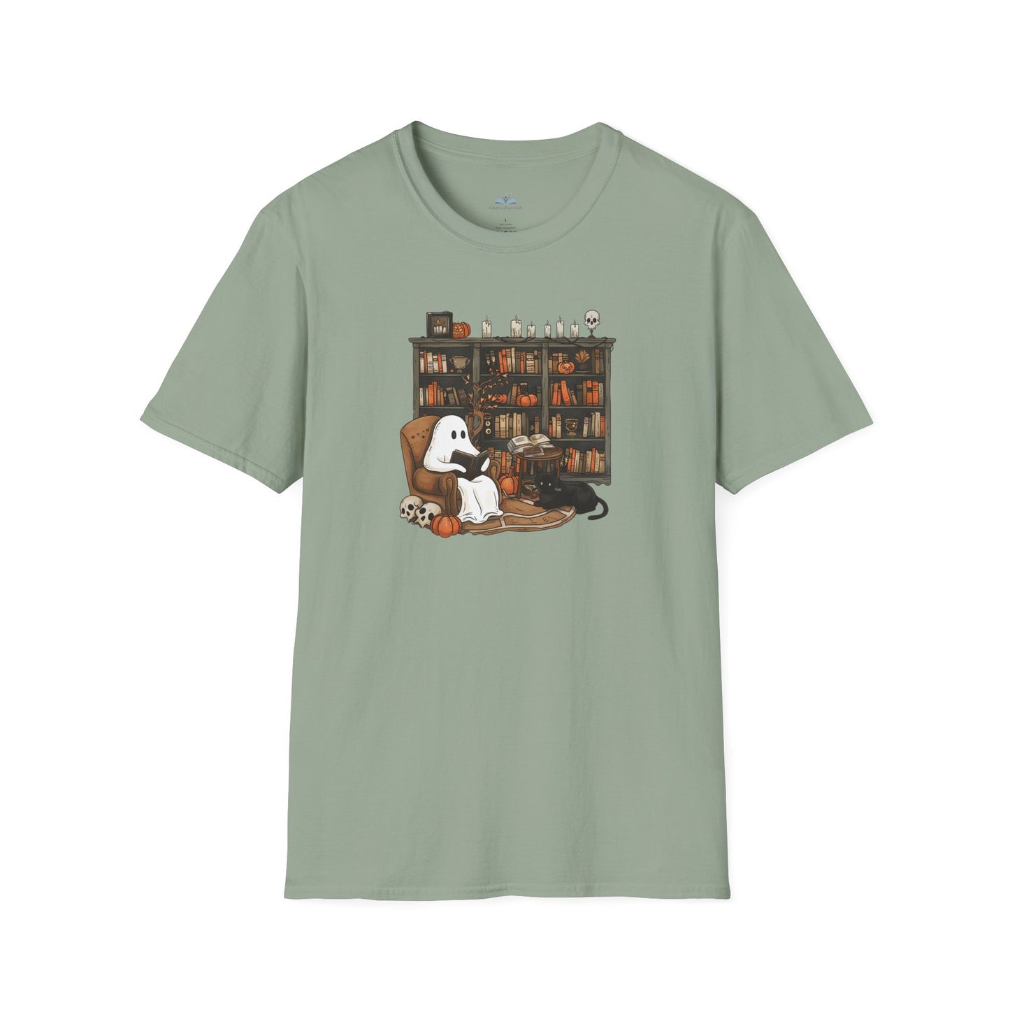 Sage green t-shirt with a graphic of a ghost, black cat, and dog on a couch in front of a bookshelf.