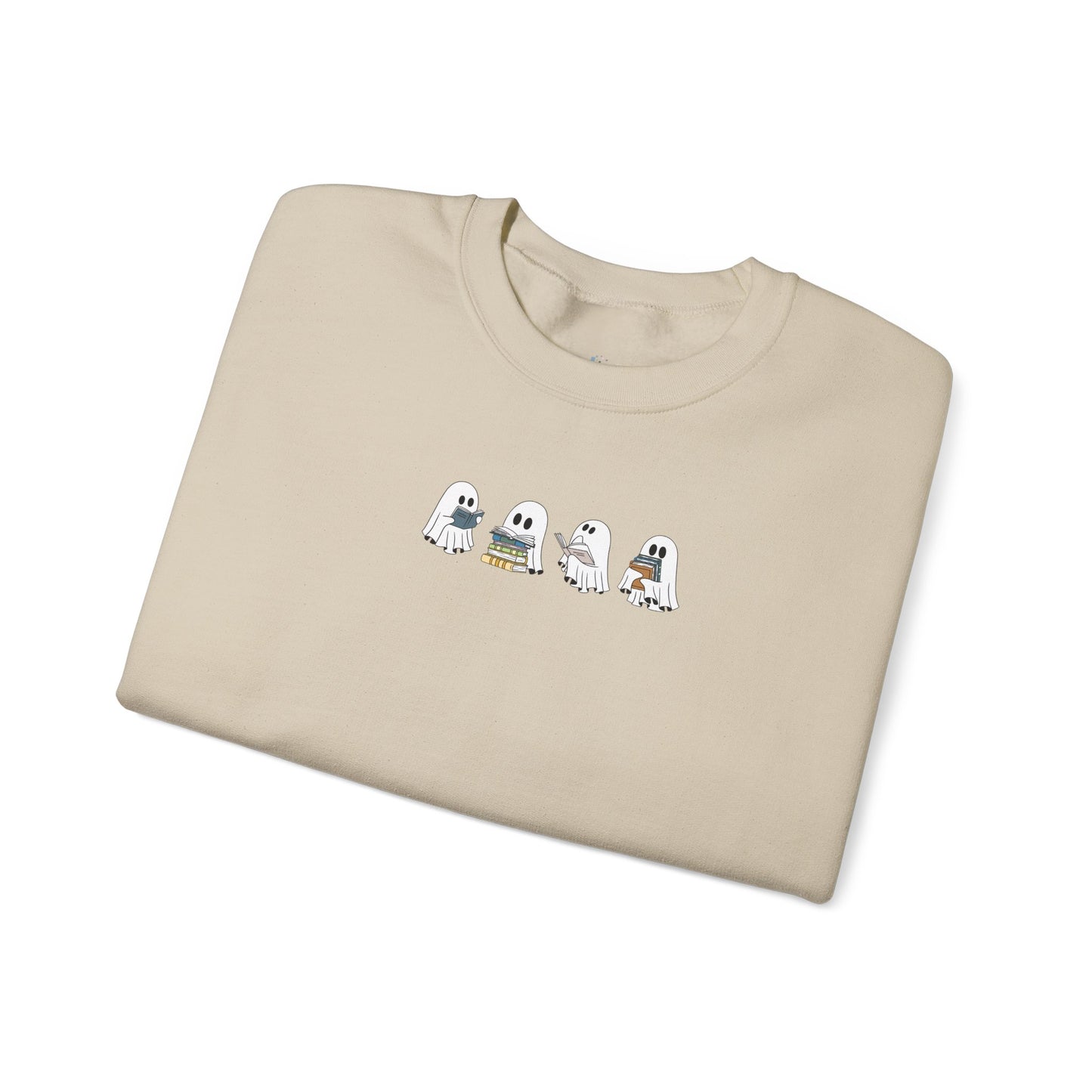 Folded beige t-shirt with cartoon ghost design on a white background