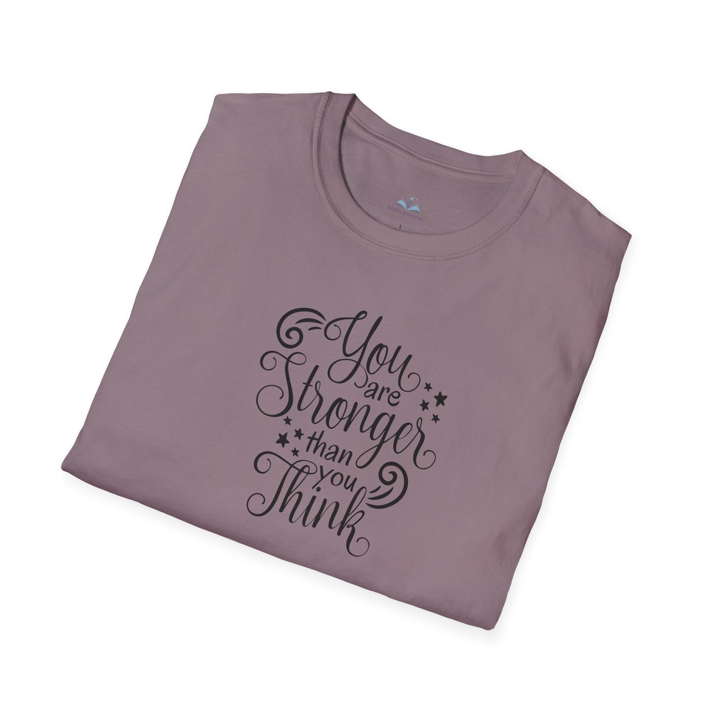 Folded mauve t-shirt with motivational quote on a white background