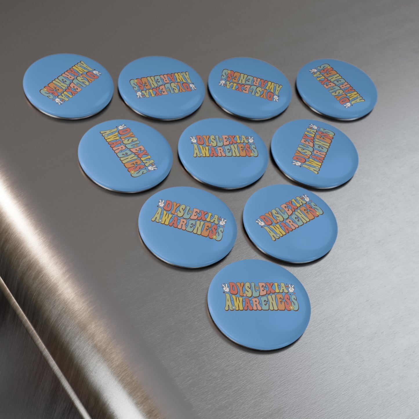 Blue buttons with 'Dyslexia Awareness' text on a metallic surface