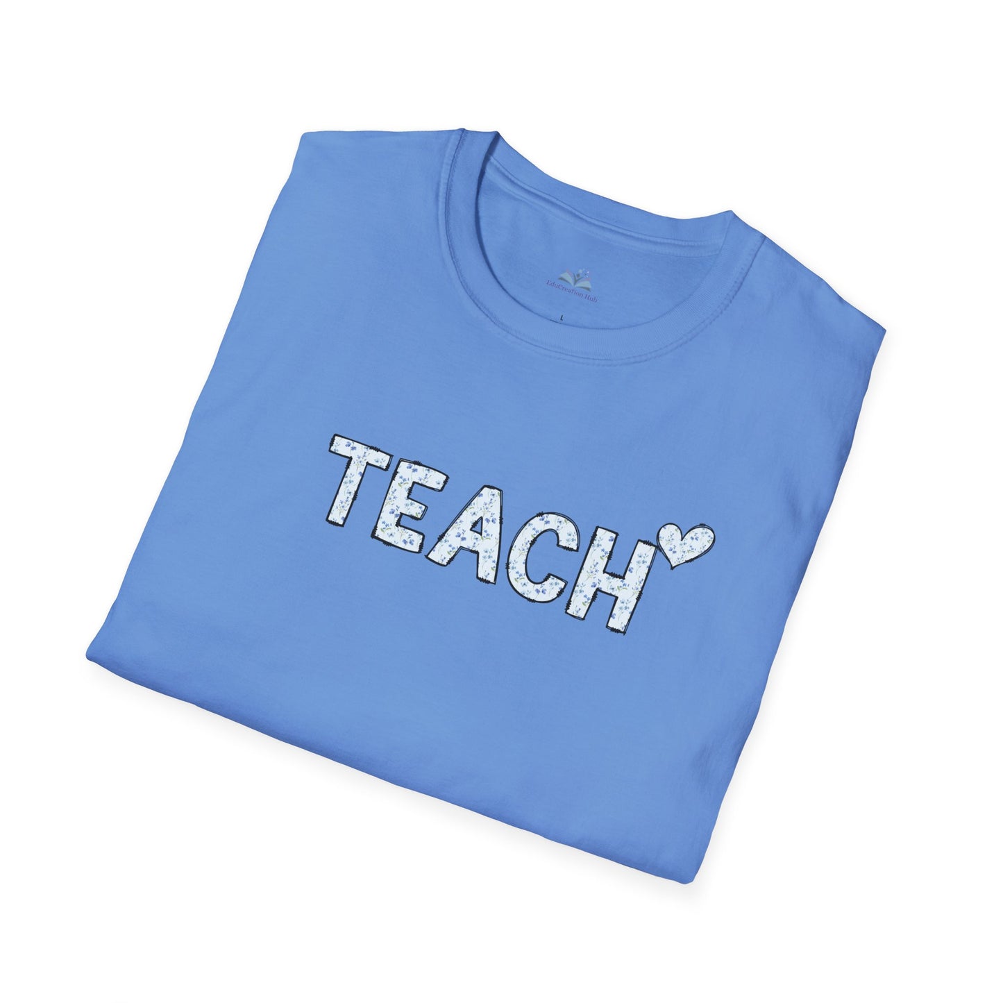 Folded blue t-shirt with 'TEACH' text on a white background