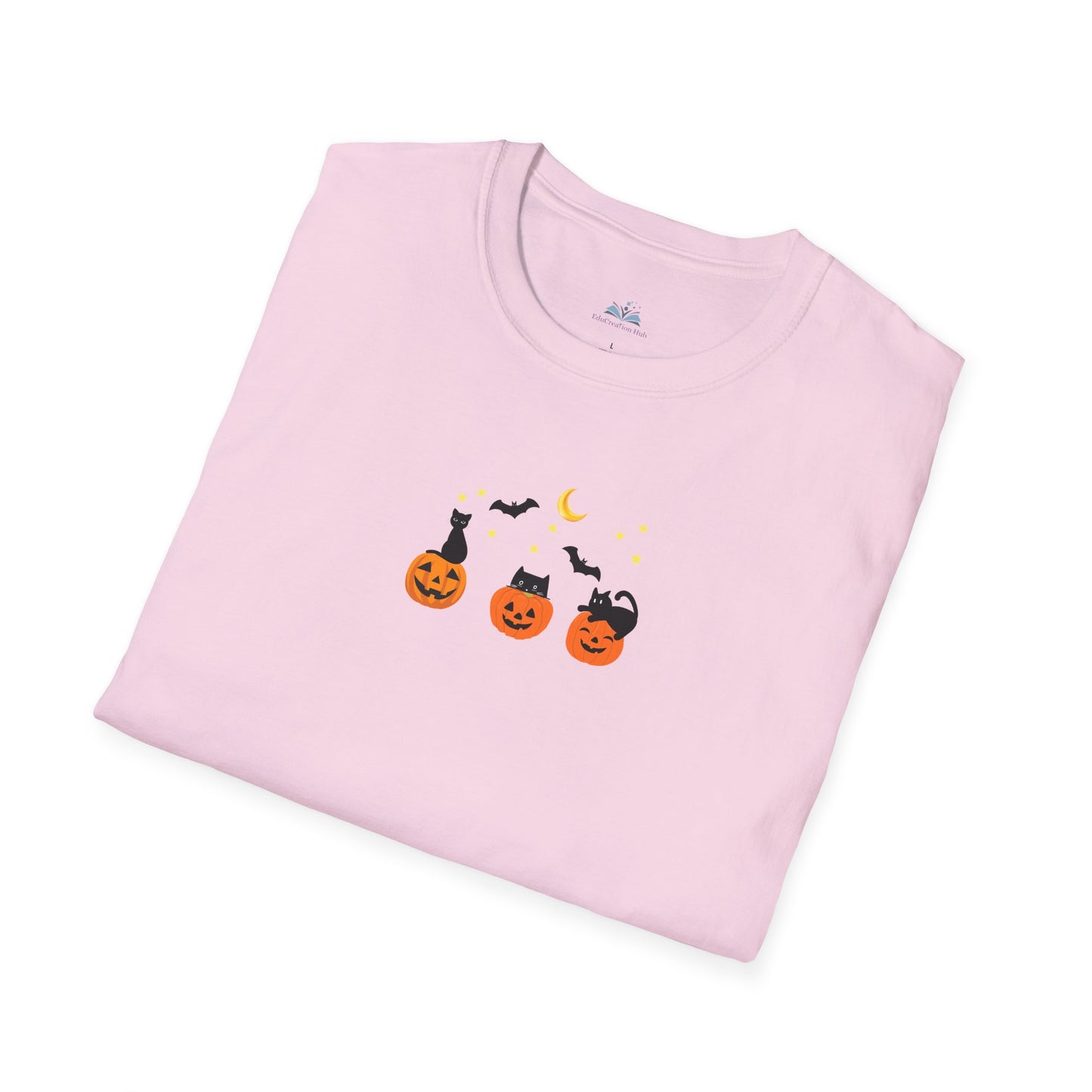 Folded pink t-shirt with Halloween-themed design on a white background