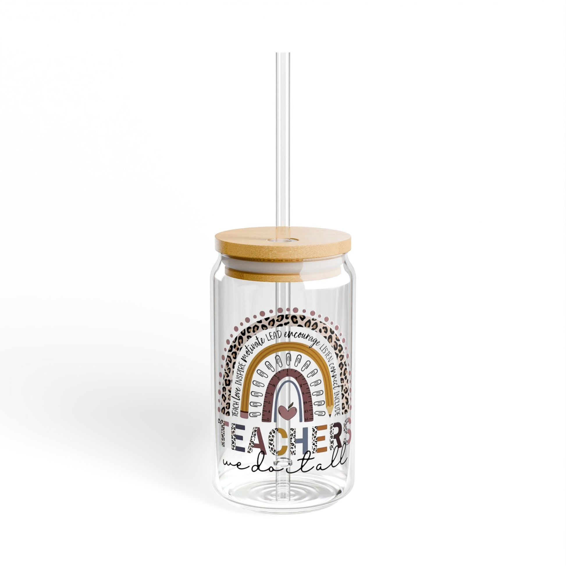 Clear tumbler with rainbow design and wooden lid on a white background
