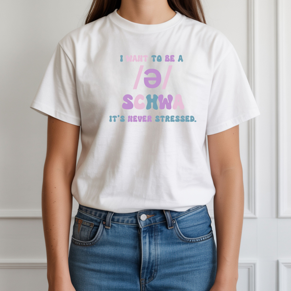 Person wearing a white t-shirt with colorful text design against a neutral background