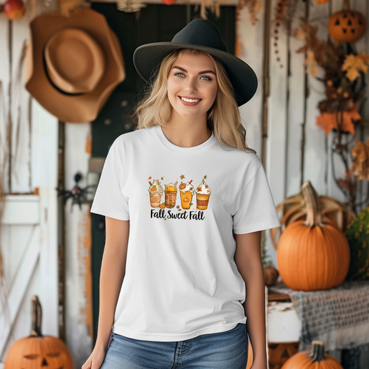 Woman wearing a white t-shirt with 'Fall Sweet Fall' design in a Halloween-themed setting.