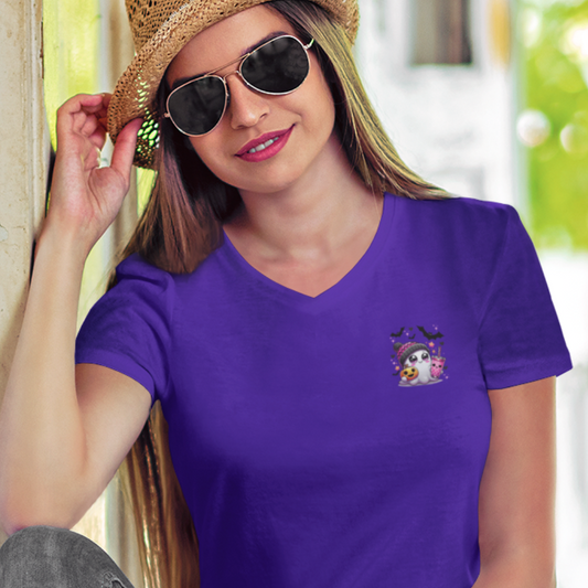 Woman wearing a purple t-shirt with a small graphic design, standing outdoors.