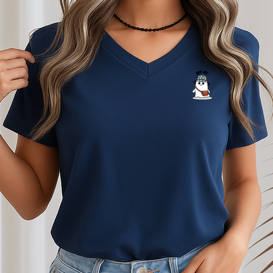 Person wearing a navy blue t-shirt with a small graphic on a plain background