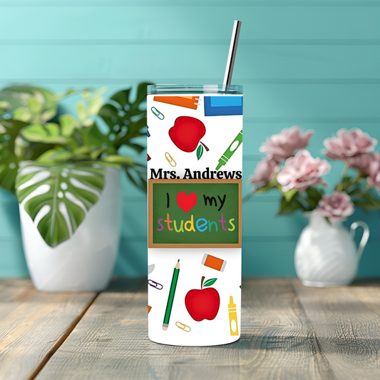 Personalized tumbler with teacher-themed design on a wooden surface with plants in the background