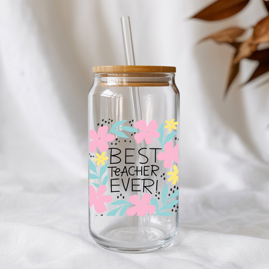 Clear glass tumbler with floral design and 'Best Teacher Ever!' text on a white background