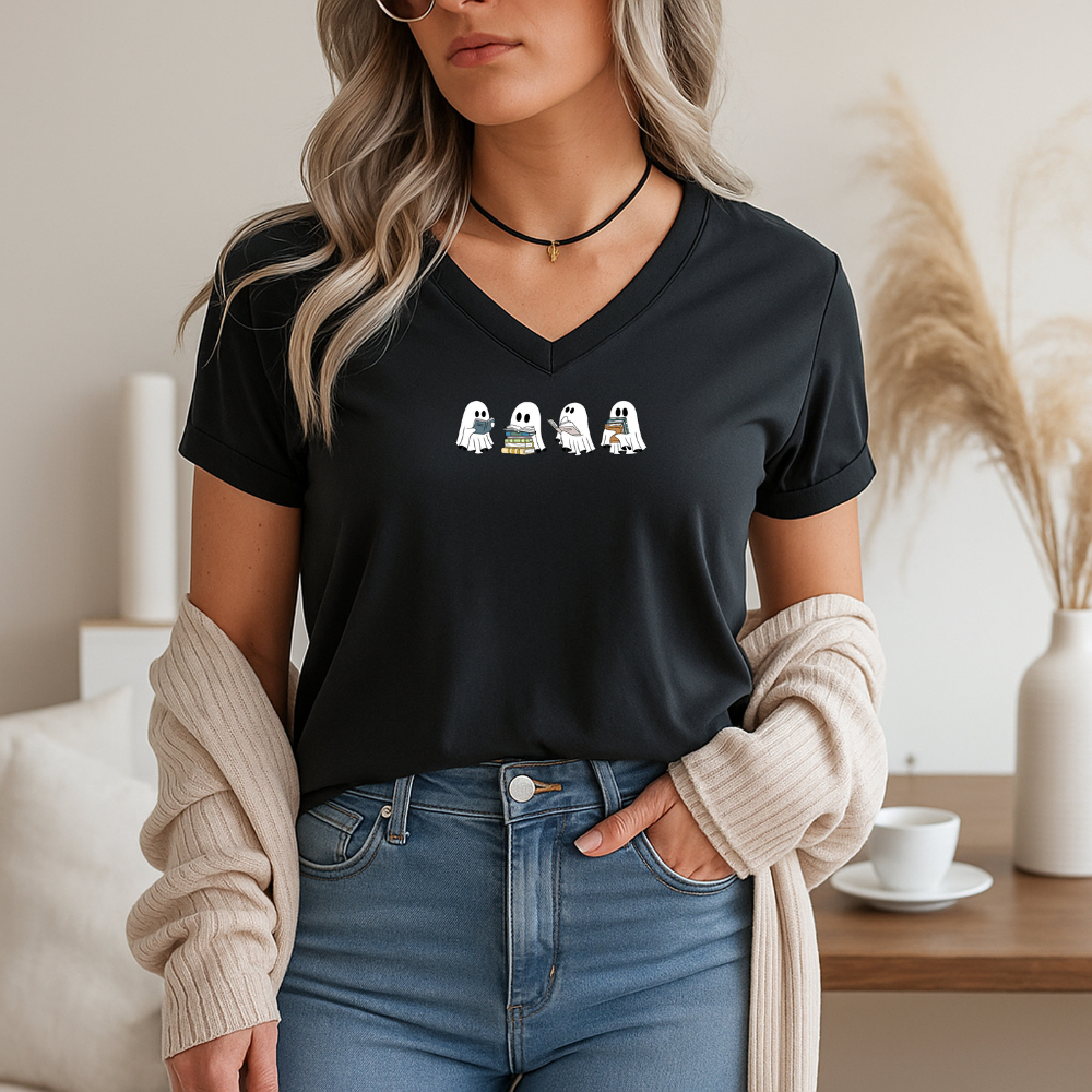 Woman wearing a black t-shirt with a graphic design, standing in a home setting.