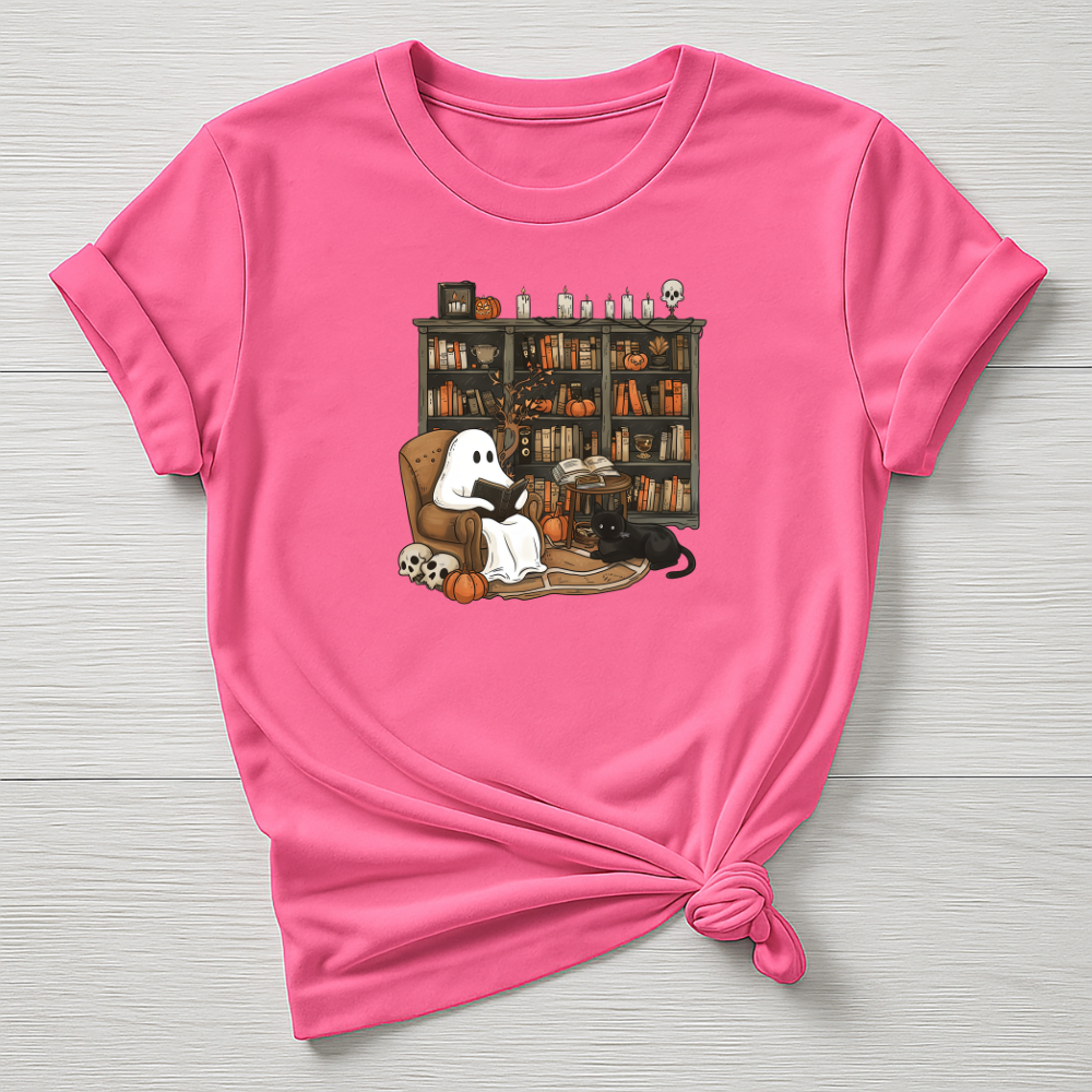 Pink t-shirt with a ghost and dog illustration on a bookshelf background