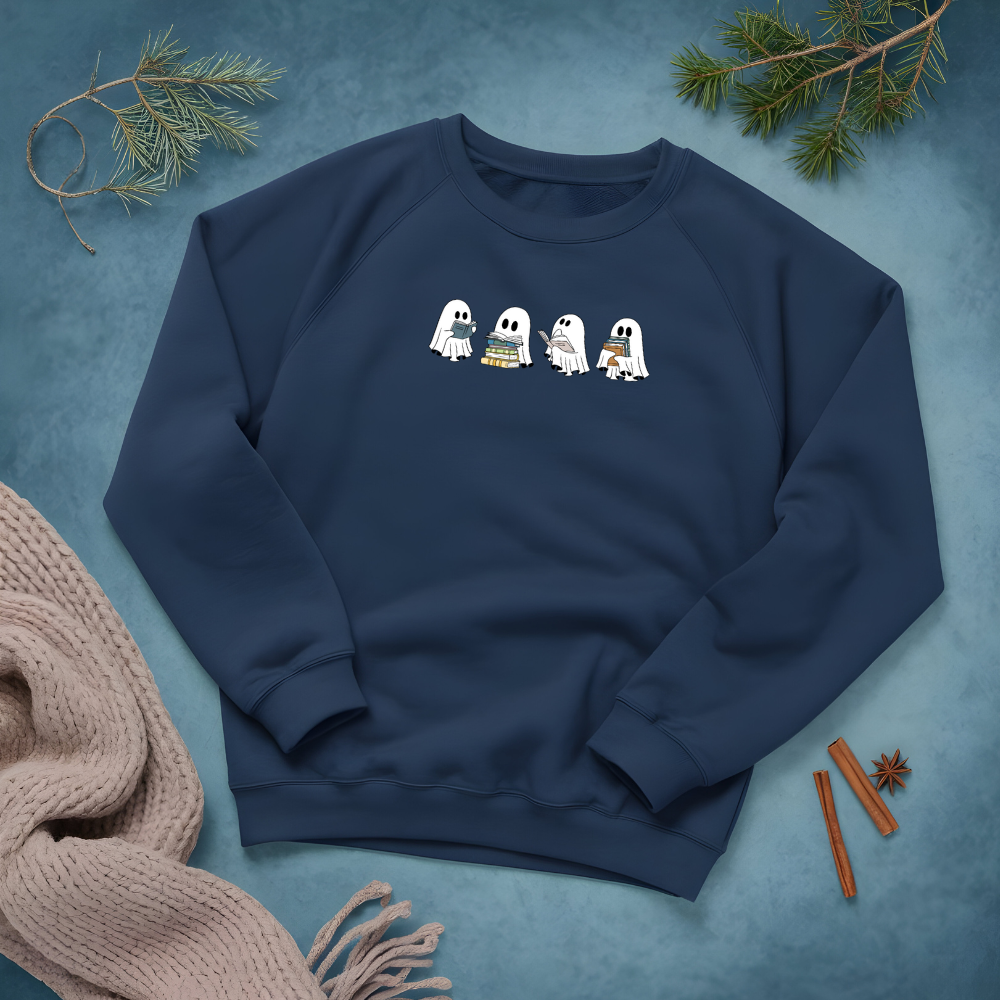Navy blue sweatshirt with cartoon ghosts on a textured blue background with decorative elements.
