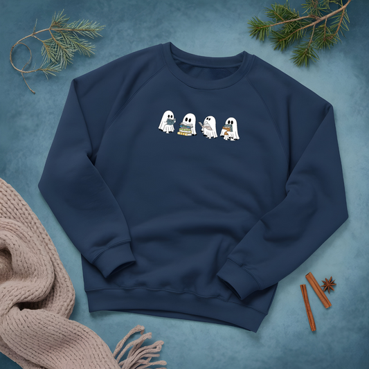 Navy blue sweatshirt with cartoon ghosts on a textured blue background with decorative elements.