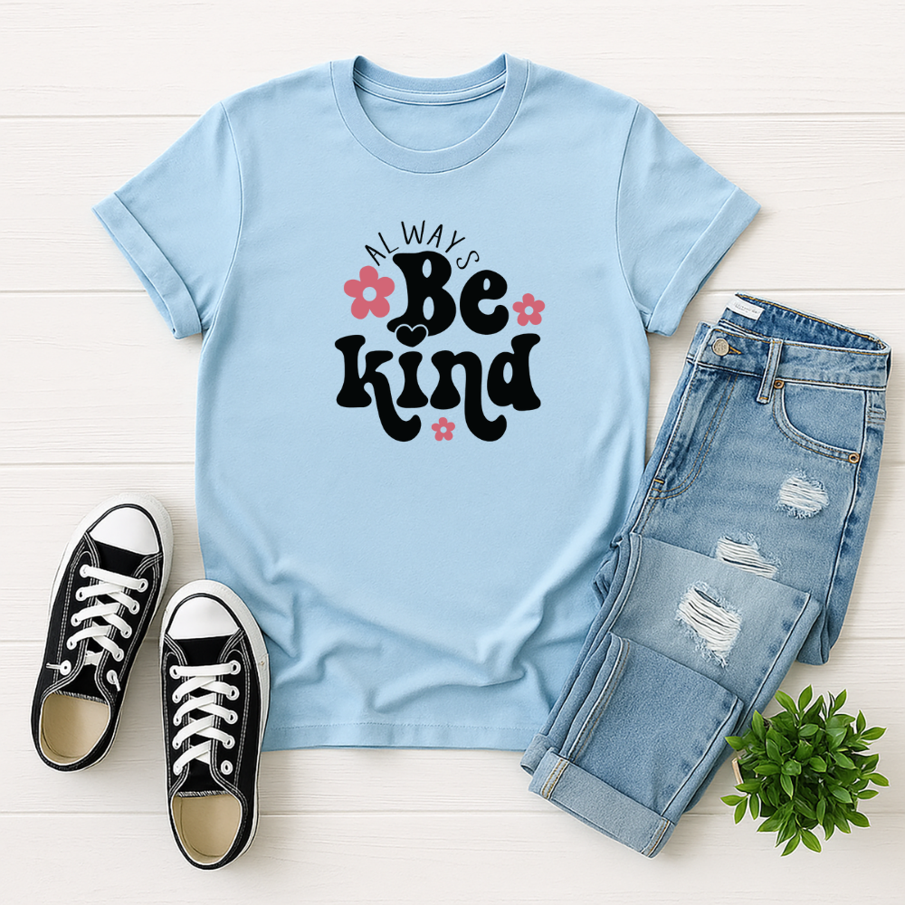 Light blue t-shirt with 'Always Be Kind' text, paired with jeans and sneakers on a white background