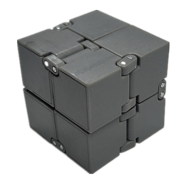 Gray fidget cube on a white background